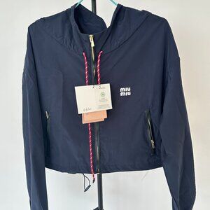 MIUMIU windbreaker, exquisitely tailored with a hood